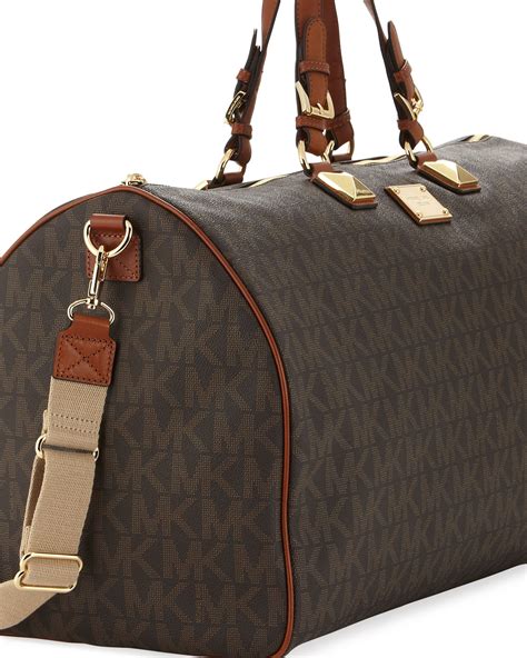 michael kors duffle bag women's|Michael Kors suitcase set.